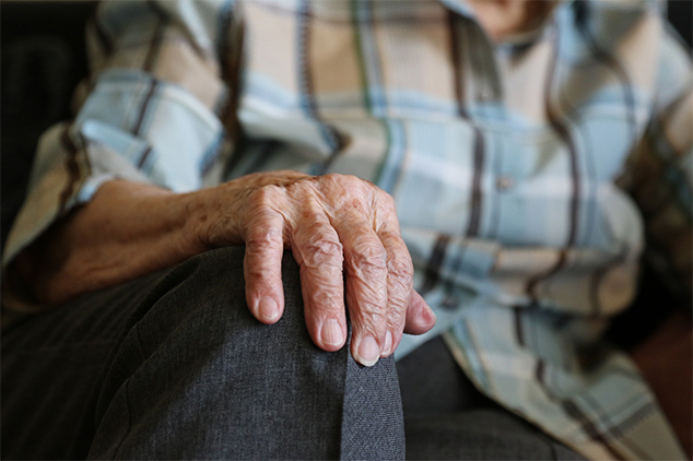 old man with hand on his knee