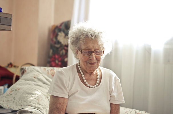 happy older woman looking down